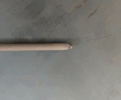 A photo of an E6013 electrode with damaged tip