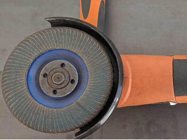 Angle grinder with flap disk